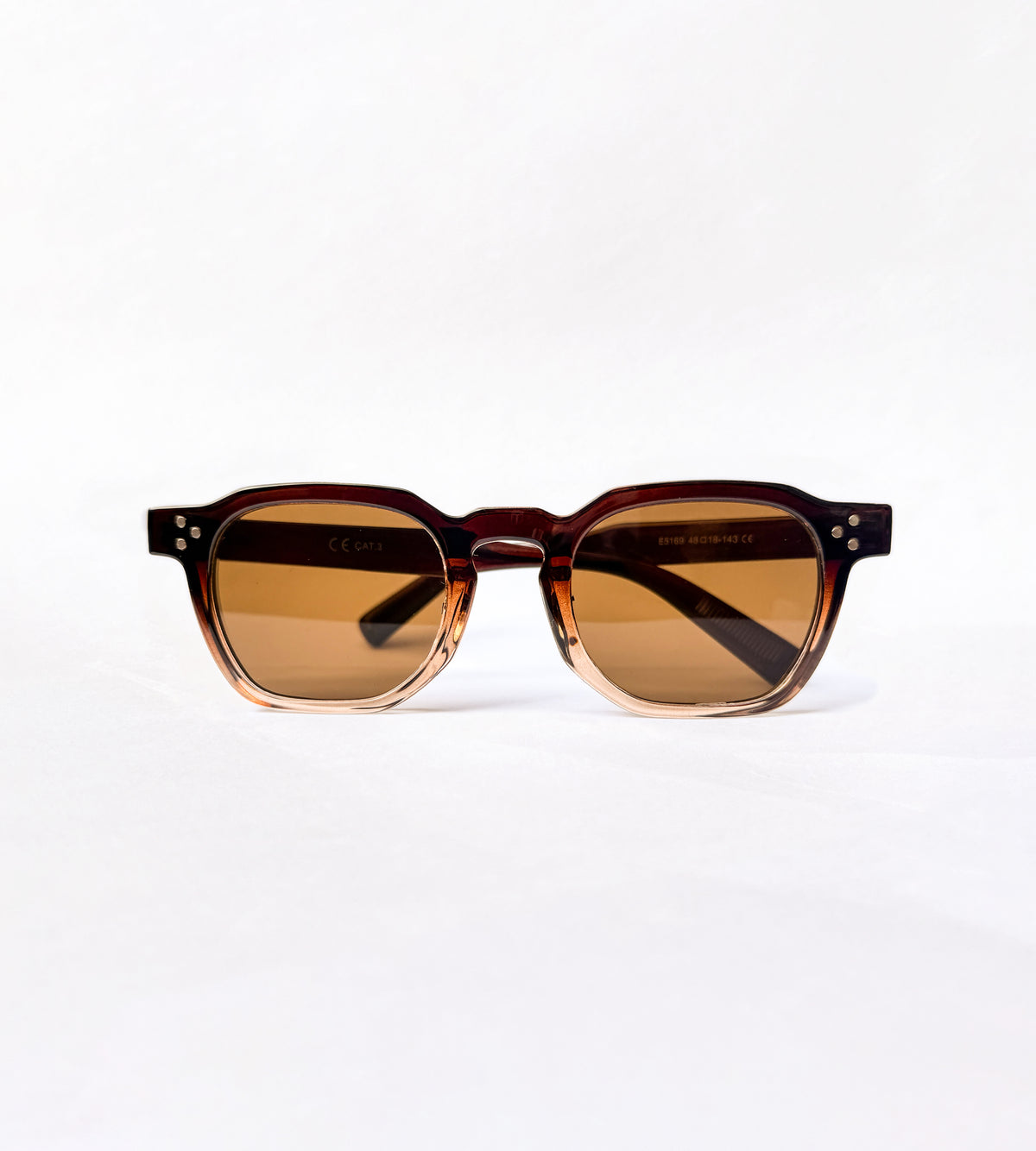 Sunglasses with brown gradient lenses on a white background amalfi eyes
