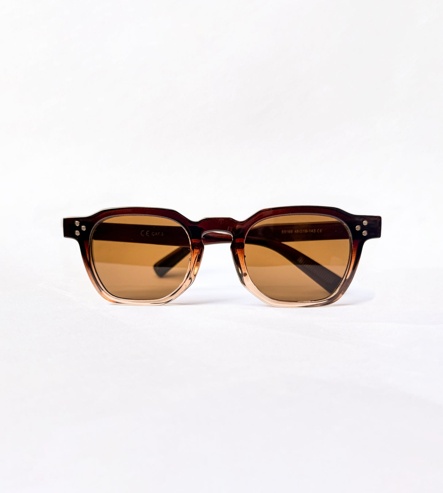 Sunglasses with brown gradient lenses on a white background amalfi eyes